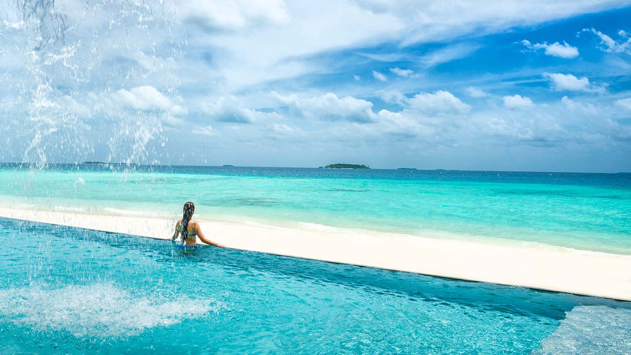 Blu beach infinity pool at Four Seasons Resort Maldives at Landaa Giraavaru