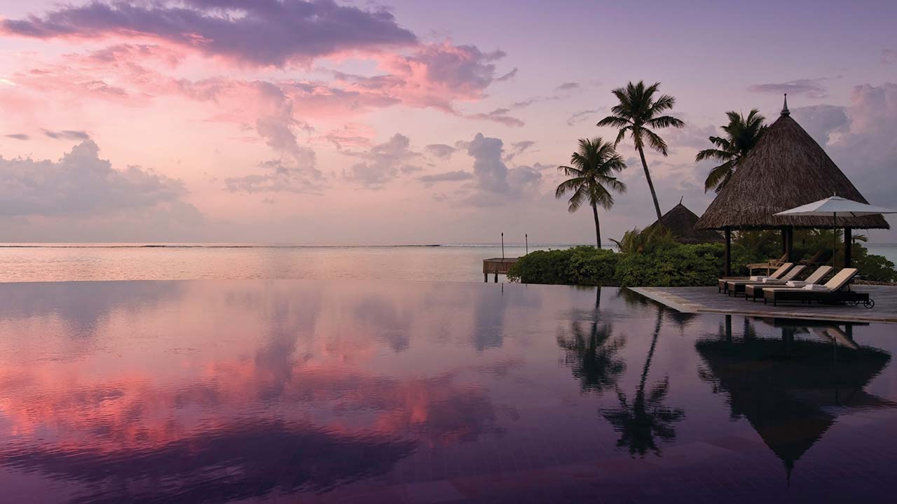 Sunset at the serenity pool at Four Seasons Resort Maldives Kuda Huraa