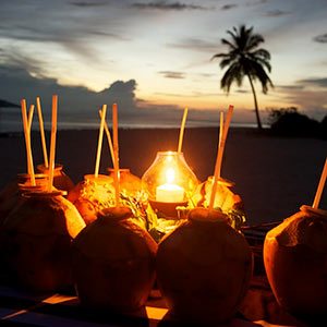 Coconut rum cocktails at sunset in the Maldives