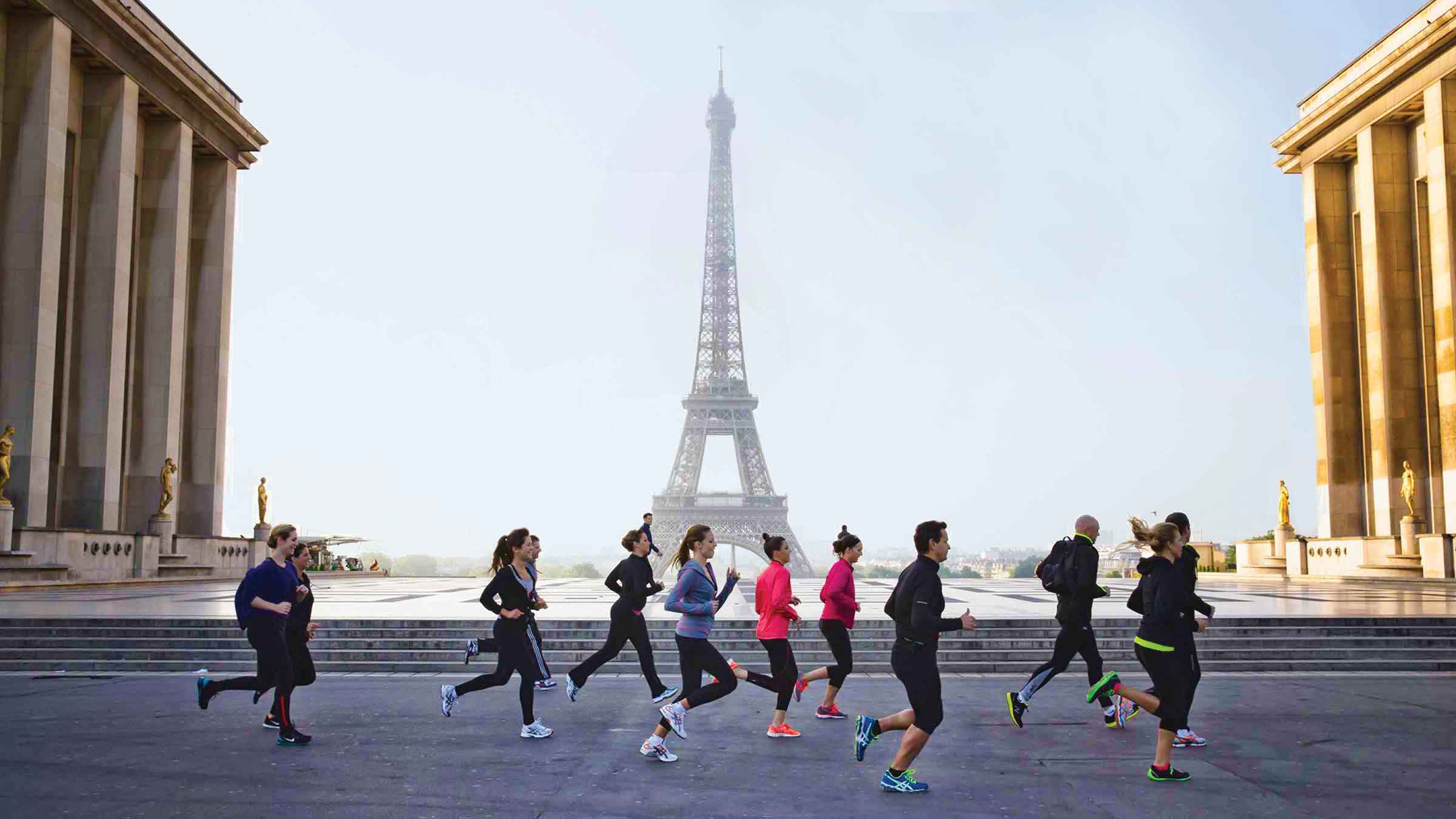 Four Seasons Hotel guests jogging past the Eiffel Tower—Paris, France