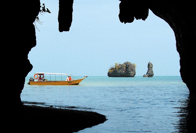 Boat and cave in Langkawi mangroves