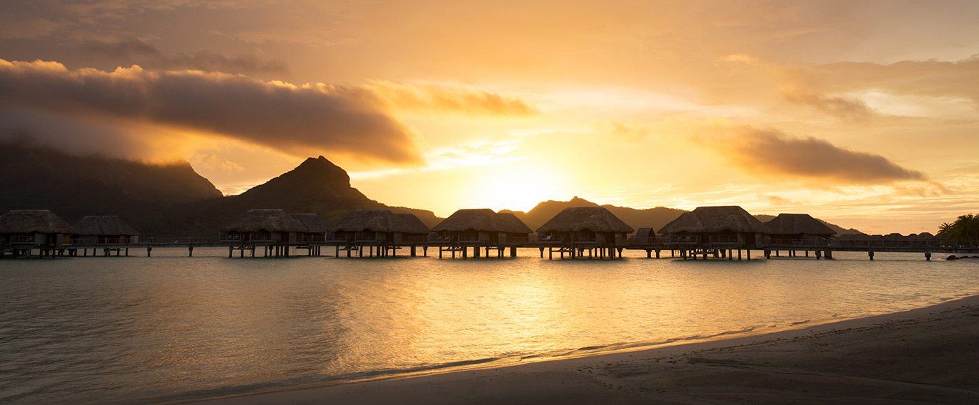 Four Seasons Bora Bora over-water bungalows at sunset