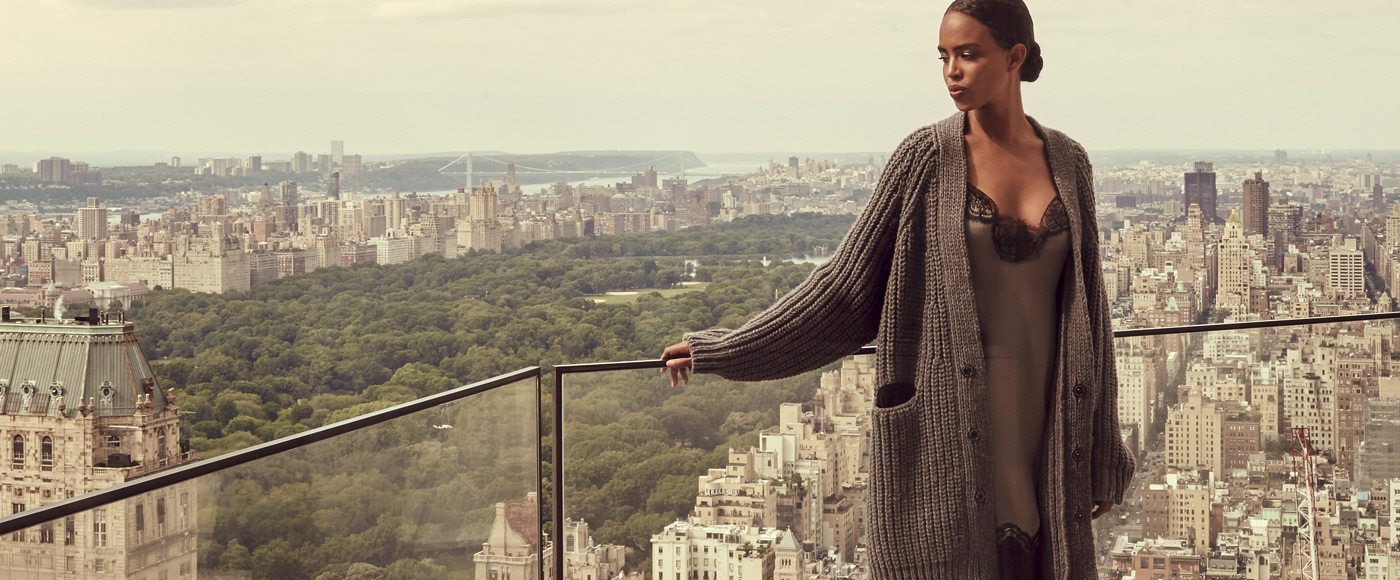 Woman on balcony overlooking New York City