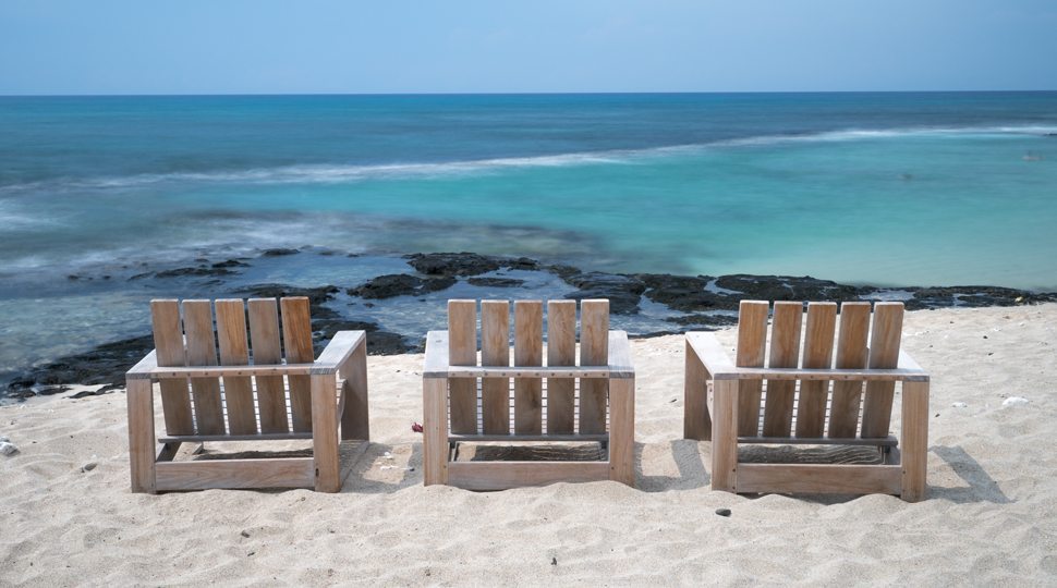 Three chairs by the beach