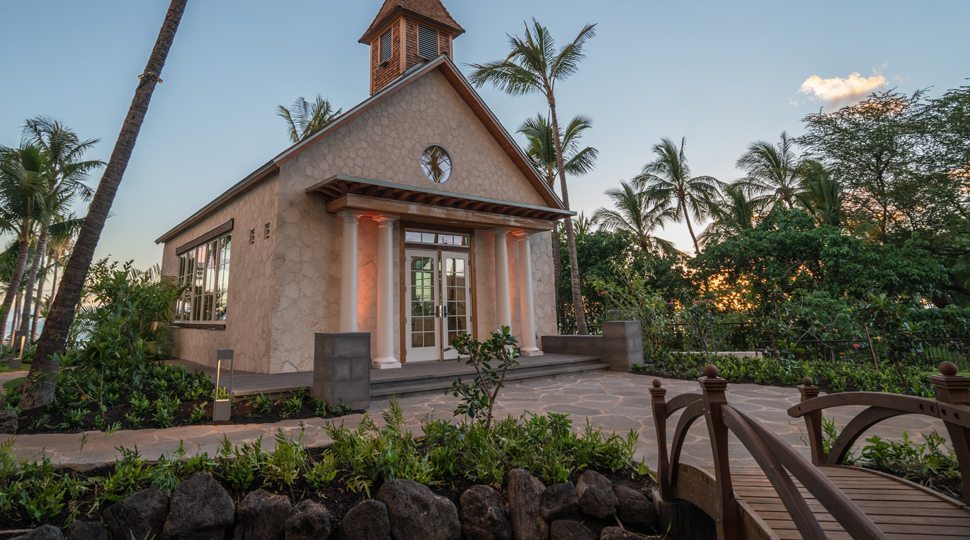 A chapel surrounded by palm trees