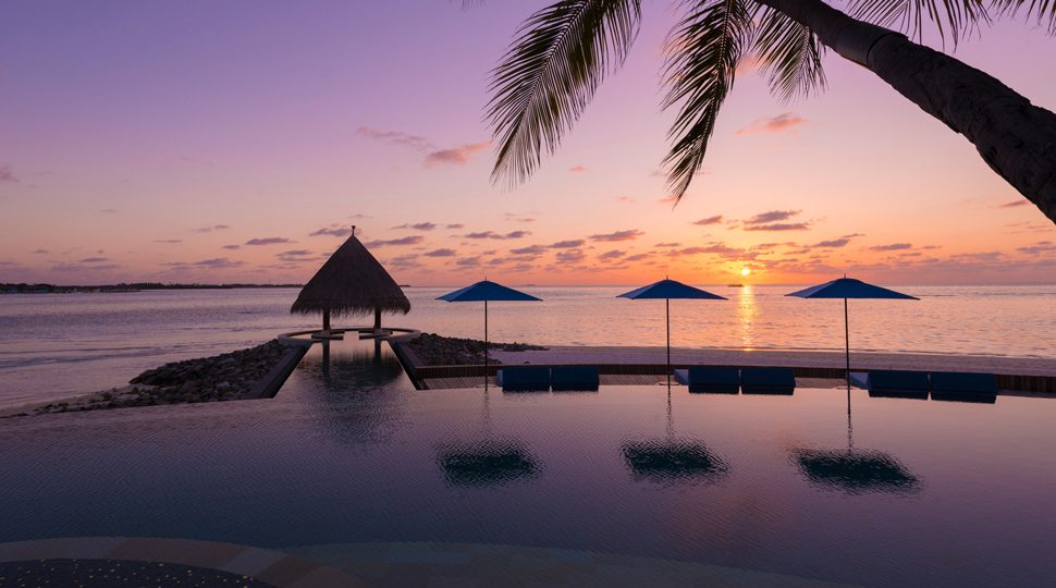 An infinity pool at sunset