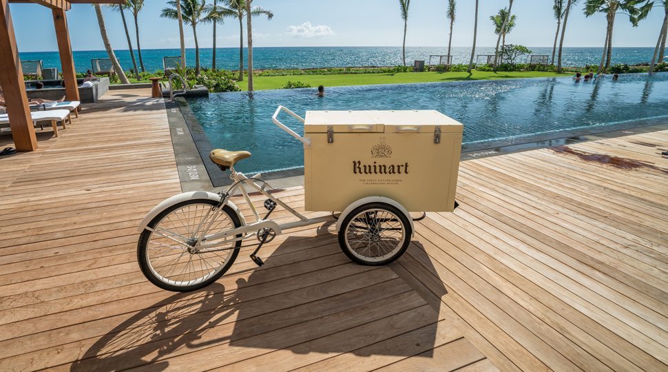 A delivery cart by pool in Oahu