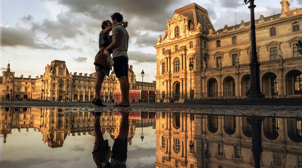 Couple in front of the Louvre