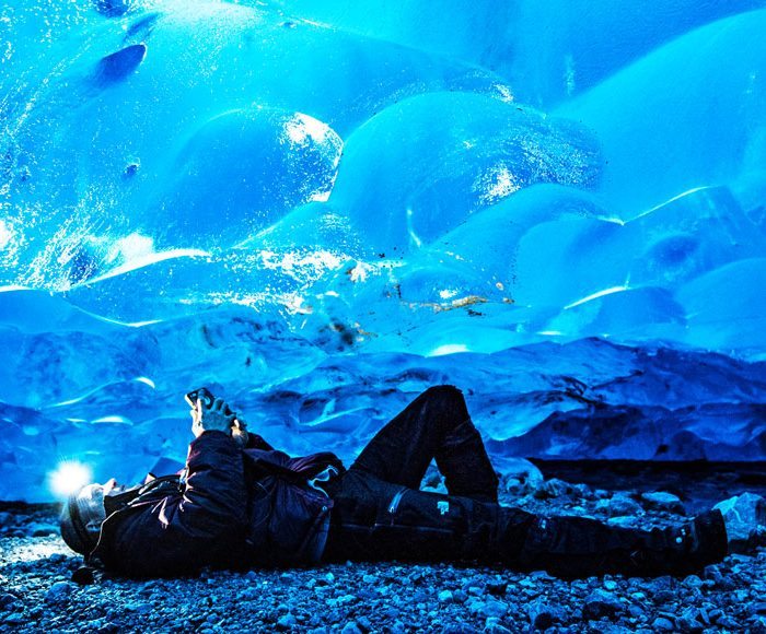 Lying on the ice cave floor in Whistler
