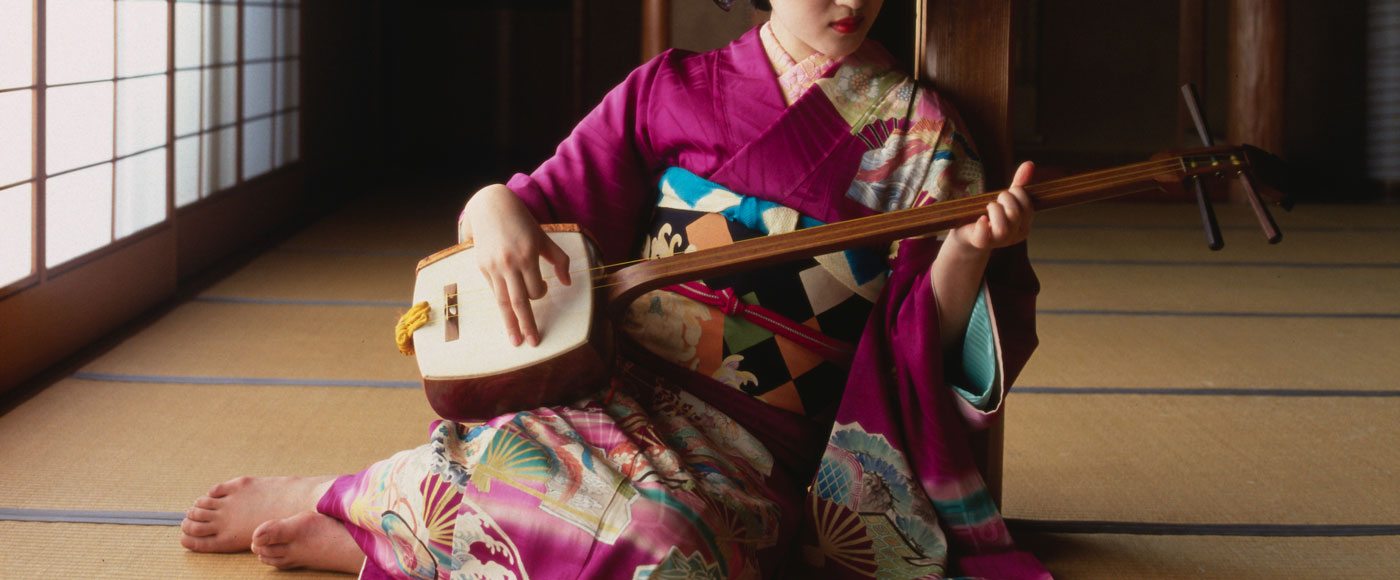 Geisha playing a shamisen