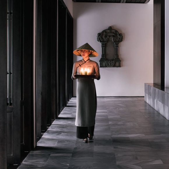 A woman holding candles in Vietnam