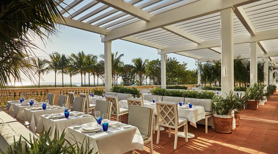Sunny outdoor dinning at the Four Seasons Surf Club Resort