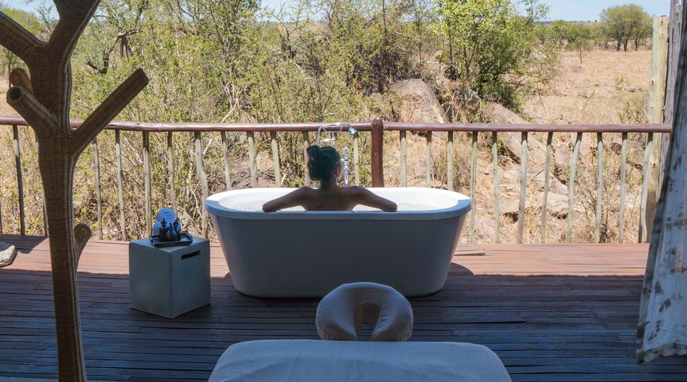 Blogger Marcy Yu enjoys the outdoor bath at the Four Seasons Serengeti