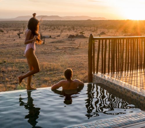 Photographer Robert Michael Poole and his partner, Marcy Yu, enjoying sunset at their private infinity pool at Four Seasons Safari Lodge Serengeti.