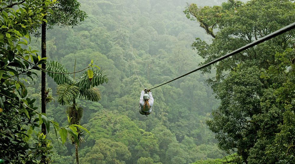 A woman zip-lines in Costa Rica