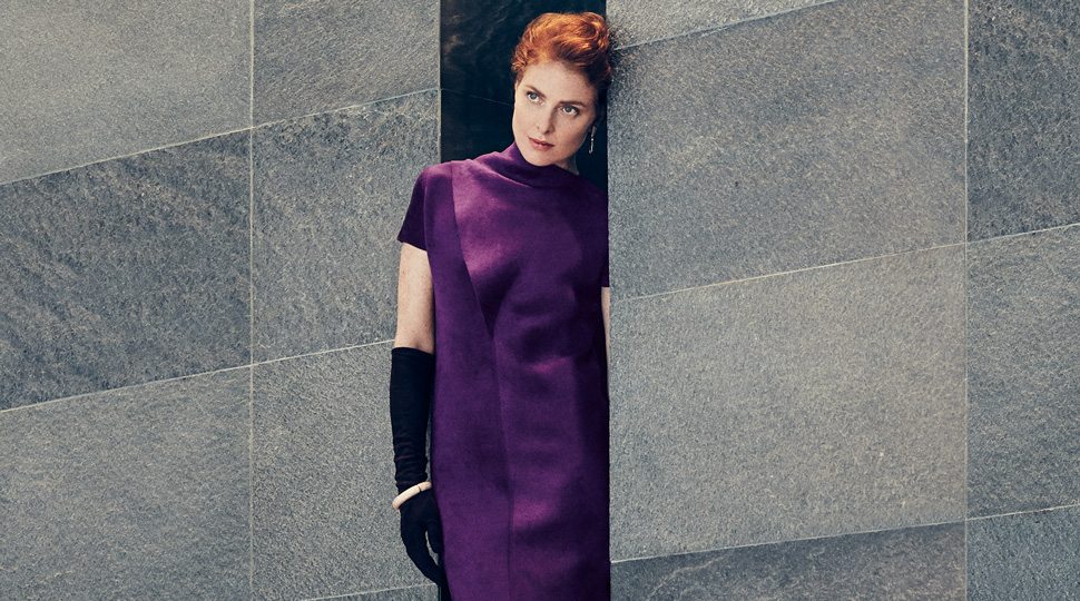 Woman in purple dress and black gloves