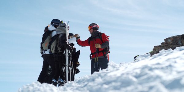 ski guide instructing guests