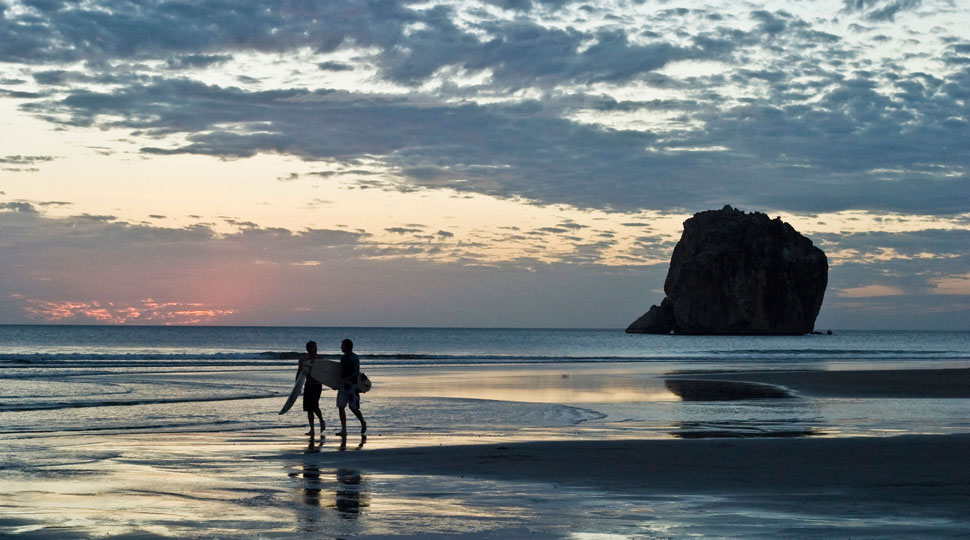 Two Surfers at Witch's Rock in Costa Rica