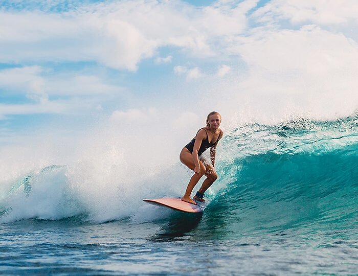 Surf Girl On Surfboard. Woman In Ocean During Surfing. Surfer And Ocean Wave
