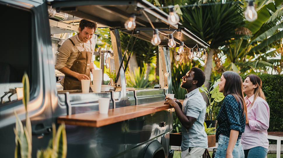Multiracial Friends Making Order To Seller In Food Truck