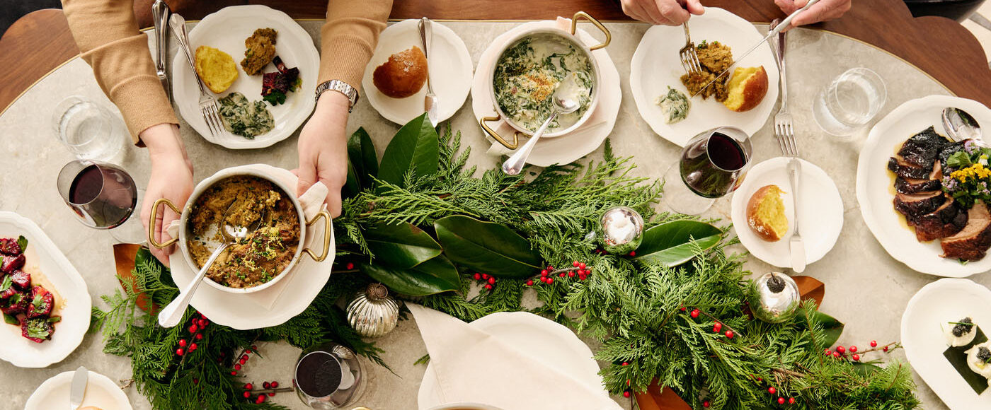 A table filled with festive decor and various food dishes