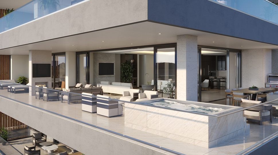 Outdoor terrace with a marble plunge pool and modern patio furniture