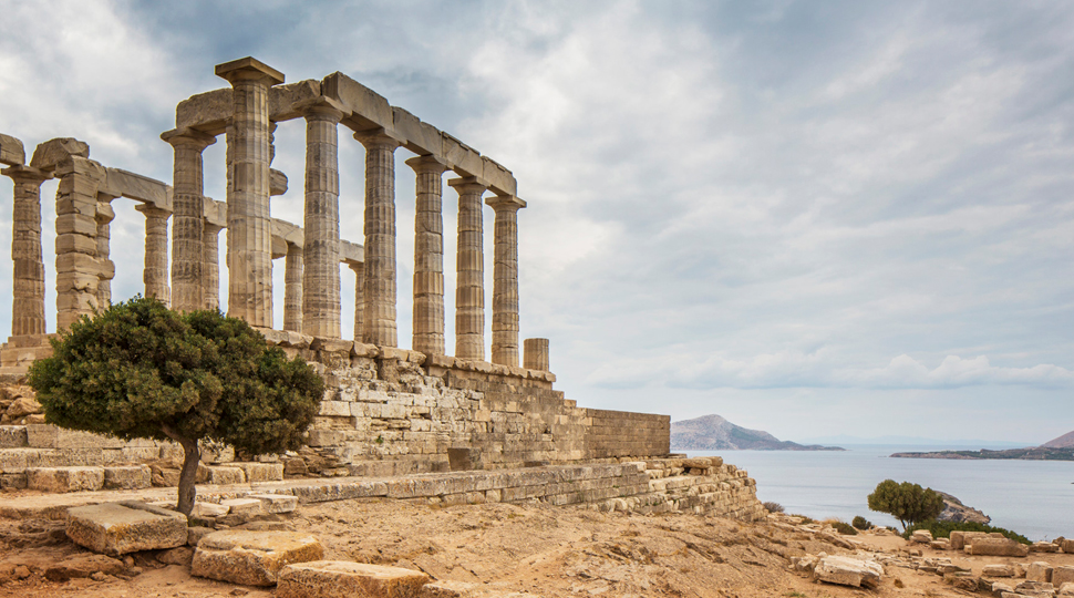 An ancient colonnade set on a ocean cliffside make up the ruins of the Temple of Poseidon at Cape Sounion