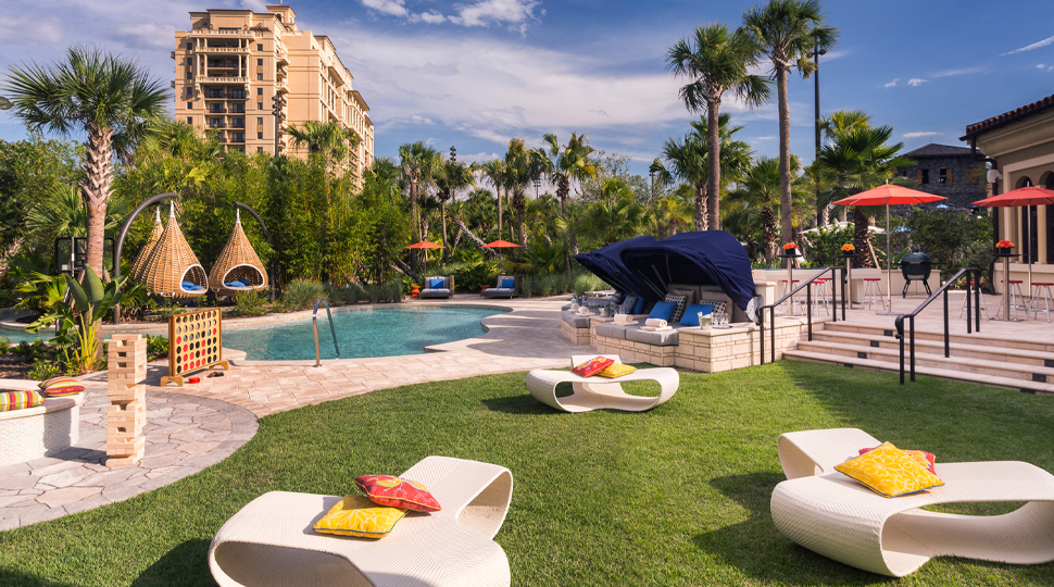 A pool lawn filled with various types of seating