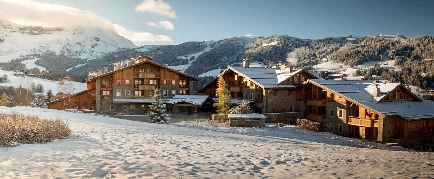 Alpine lodge surrounded by snow-covered mountains